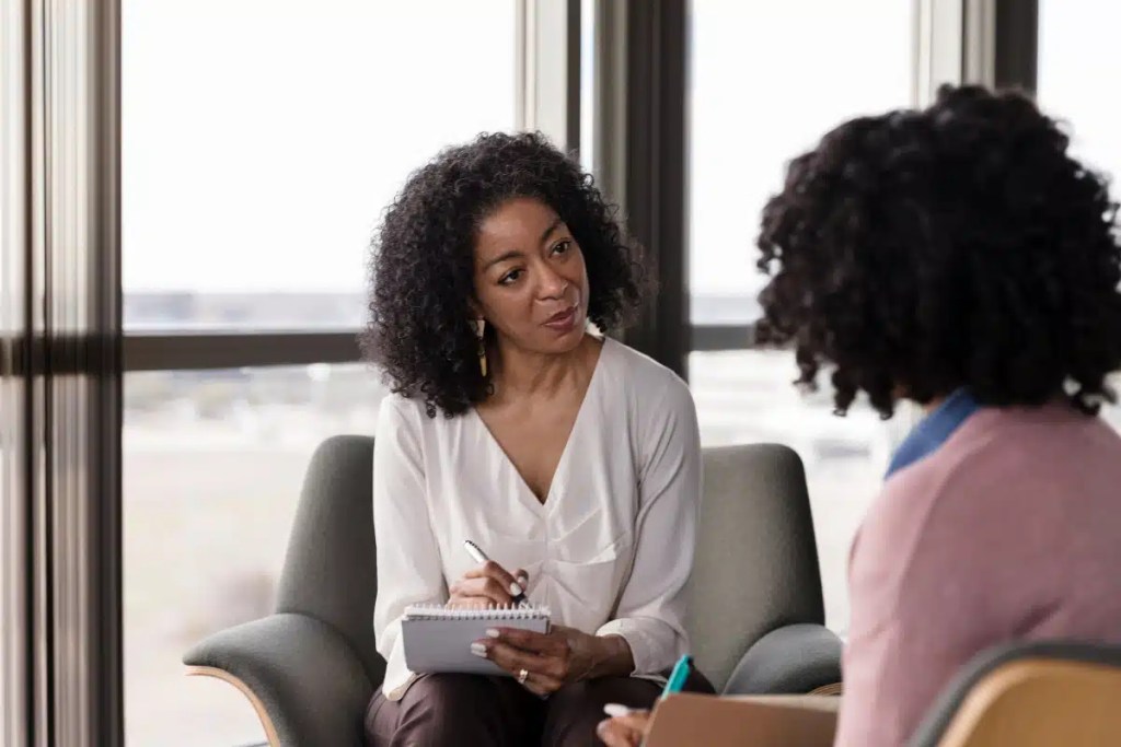 Two women engaged in conversation.