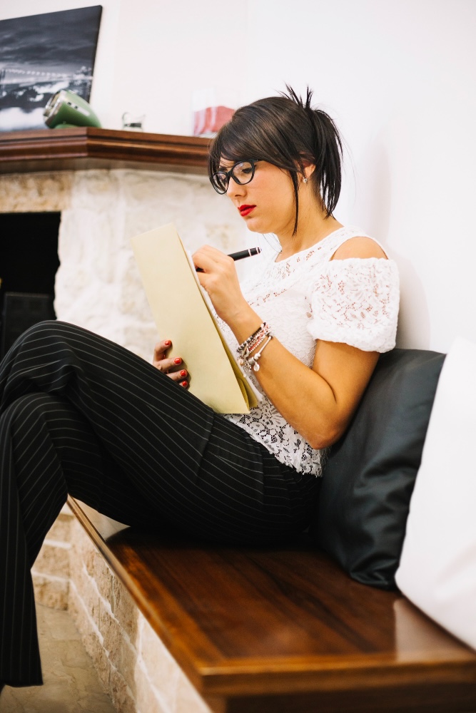 Woman reading on a wooden bench
