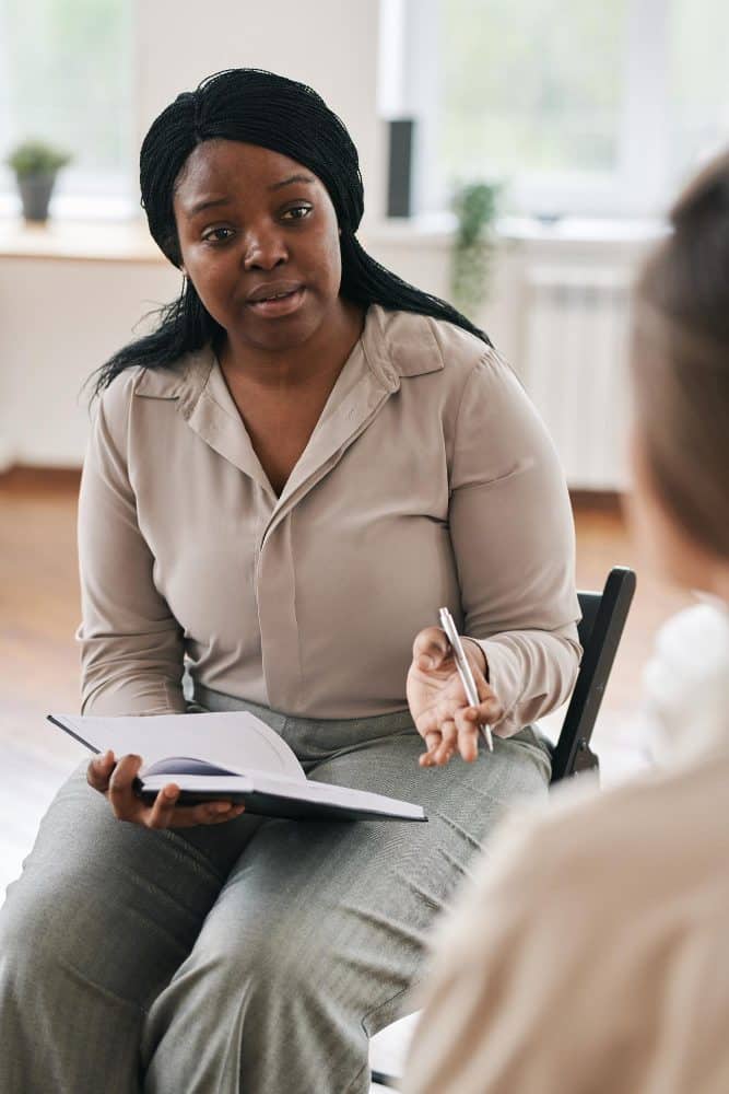 Woman discussing with another person