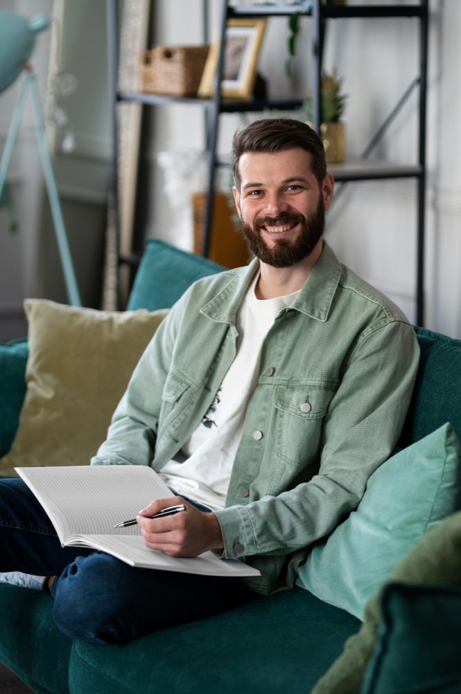 Smiling man sitting on couch